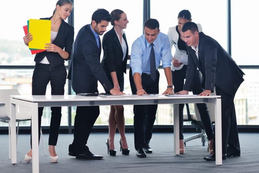 Group of happy young  business people in a meeting at office