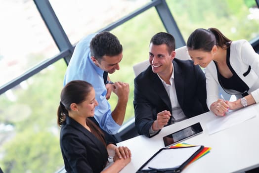 Group of happy young  business people in a meeting at office