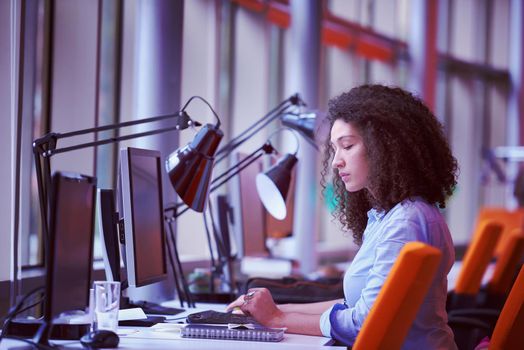 happy young  business woman with curly hairstyle in the modern office