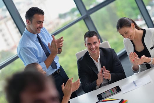 Group of happy young  business people in a meeting at office