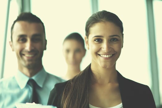 Group of happy young  business people in a meeting at office