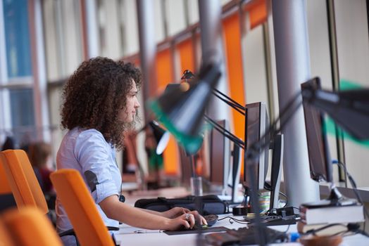 happy young  business woman with curly hairstyle in the modern office