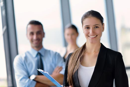 Group of happy young  business people in a meeting at office