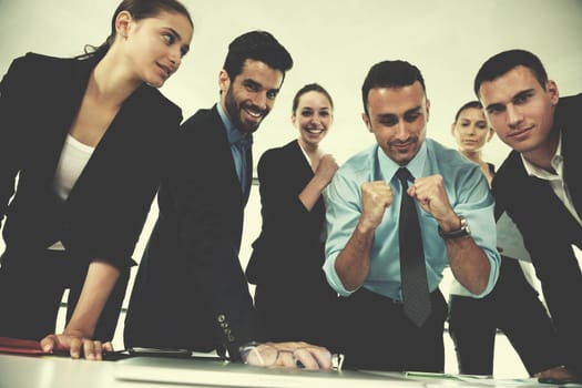 Group of happy young  business people in a meeting at office