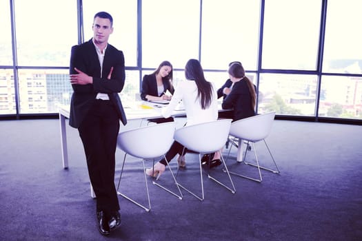 Group of happy young  business people in a meeting at office