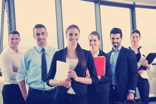 Group of happy young  business people in a meeting at office