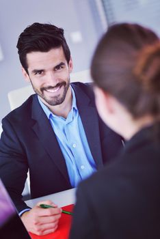 Group of happy young  business people in a meeting at office