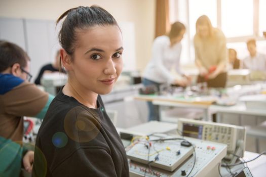 Group of young students doing technical vocational practice with teacher in the electronic classroom, Education and technology concept