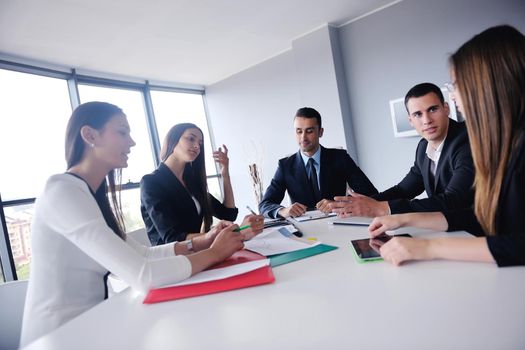 Group of happy young  business people in a meeting at office