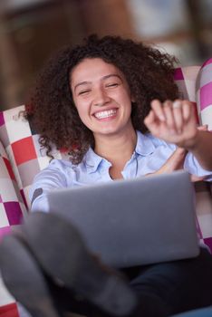 happy young  business woman with curly hairstyle in the modern office