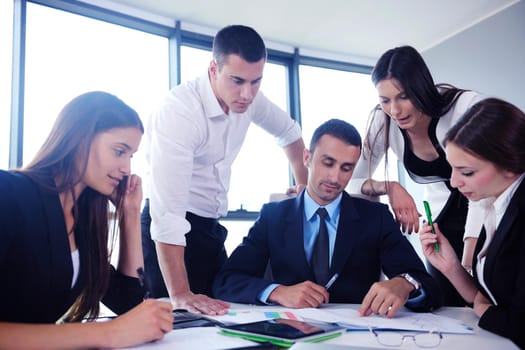 Group of happy young  business people in a meeting at office