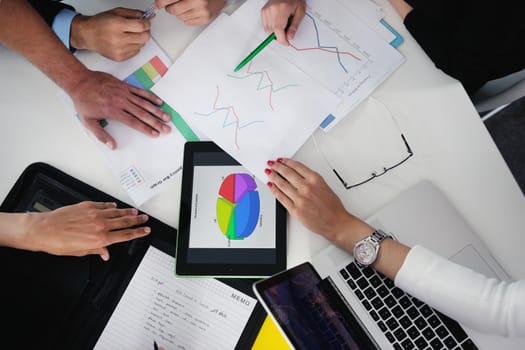 Group of happy young  business people in a meeting at office