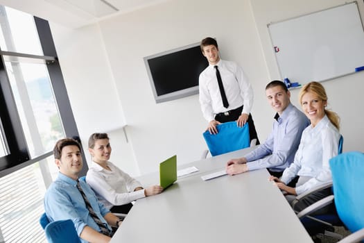 Group of happy young  business people in a meeting at office