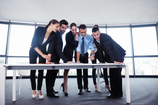 Group of happy young  business people in a meeting at office