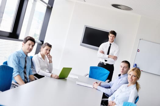 Group of happy young  business people in a meeting at office