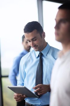 close-up of human hand  business man using tablet compuer at office