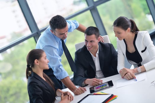 Group of happy young  business people in a meeting at office