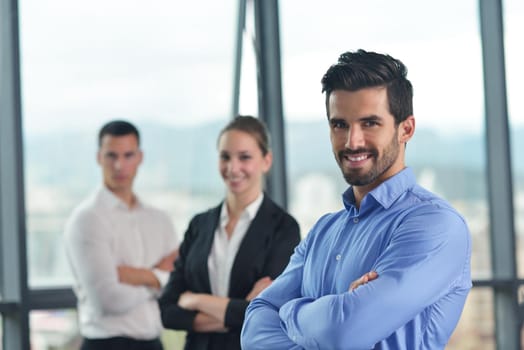 Group of happy young  business people in a meeting at office