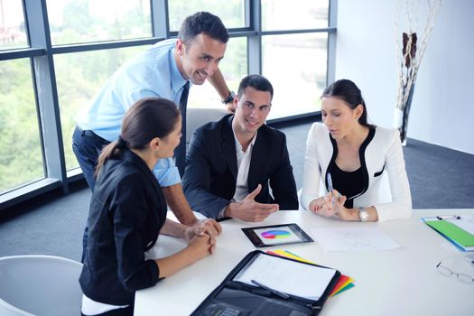 Group of happy young  business people in a meeting at office