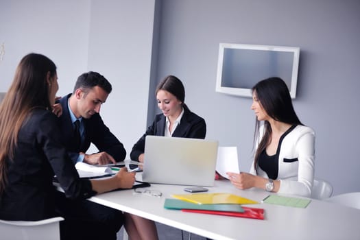 Group of happy young  business people in a meeting at office