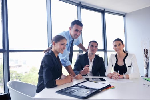 Group of happy young  business people in a meeting at office