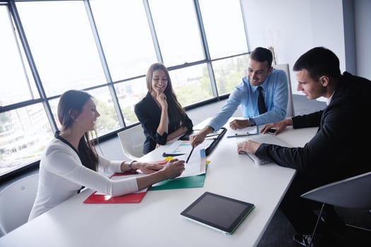 Group of happy young  business people in a meeting at office