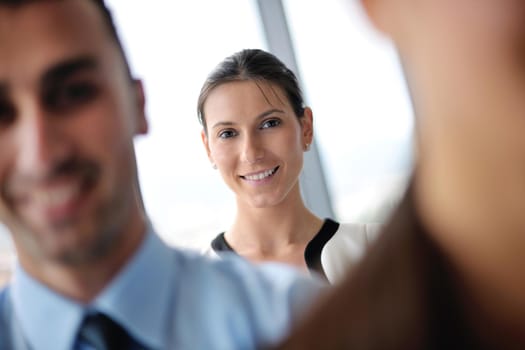 Group of happy young  business people in a meeting at office