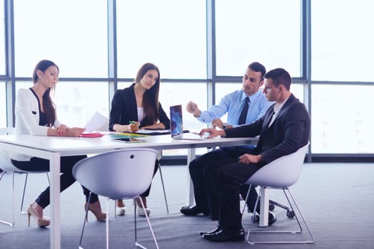 Group of happy young  business people in a meeting at office