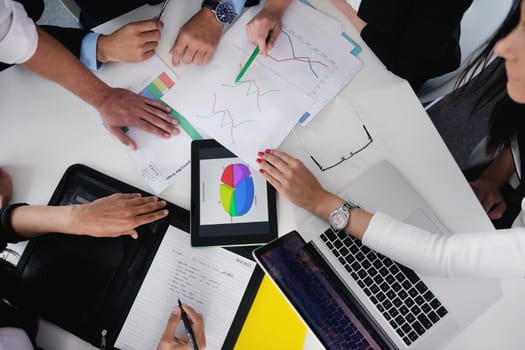 Group of happy young  business people in a meeting at office