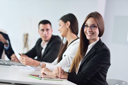 Group of happy young  business people in a meeting at office