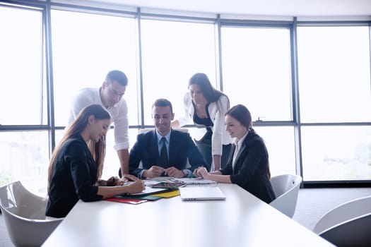 Group of happy young  business people in a meeting at office