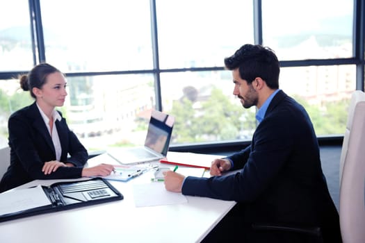 Group of happy young  business people in a meeting at office