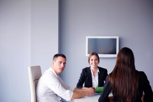 Group of happy young  business people in a meeting at office