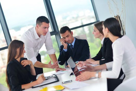 Group of happy young  business people in a meeting at office