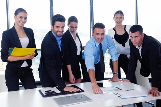 Group of happy young  business people in a meeting at office