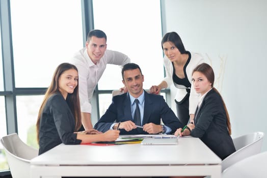 Group of happy young  business people in a meeting at office