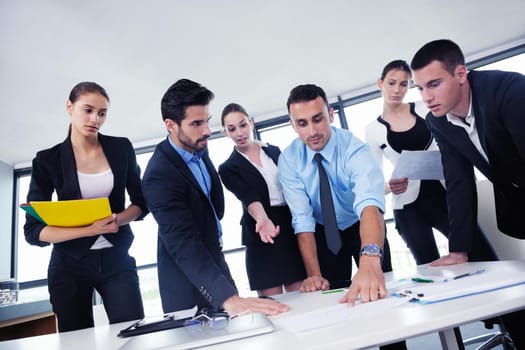 Group of happy young  business people in a meeting at office