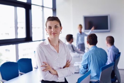 business woman  with her staff,  people group in background at modern bright office indoors