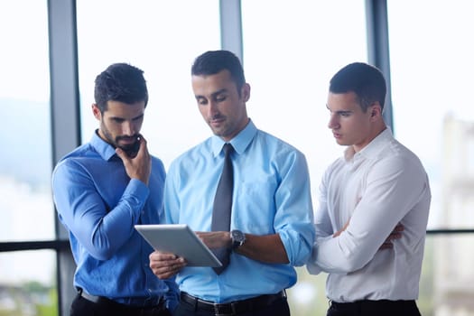 Group of happy young  business people in a meeting at office