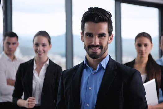 Group of happy young  business people in a meeting at office