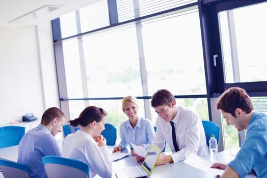 Group of happy young  business people in a meeting at office