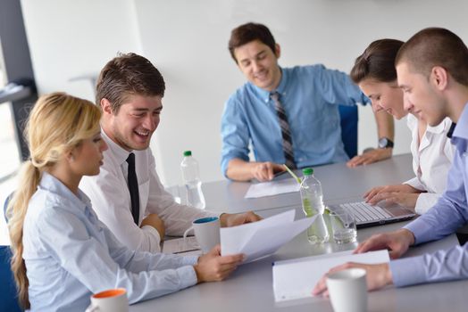 Group of happy young  business people in a meeting at office