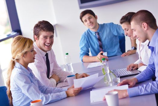 Group of happy young  business people in a meeting at office