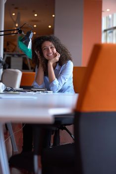 happy young  business woman with curly hairstyle in the modern office