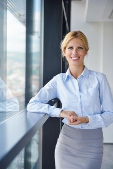 business woman  with her staff,  people group in background at modern bright office indoors