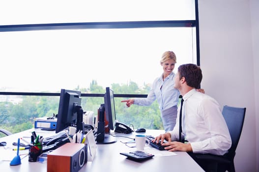 Group of happy young  business people in a meeting at office