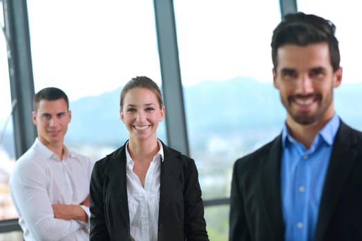 Group of happy young  business people in a meeting at office