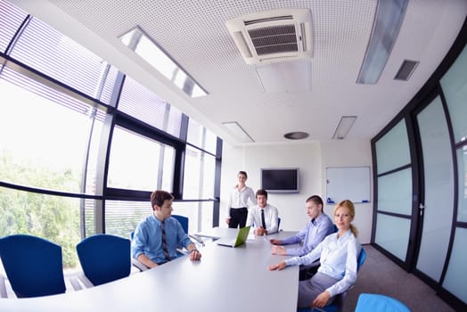 Group of happy young  business people in a meeting at office