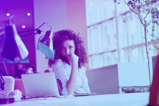 happy young  business woman with curly hairstyle in the modern office