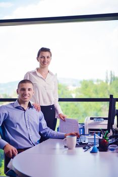 Group of happy young  business people in a meeting at office